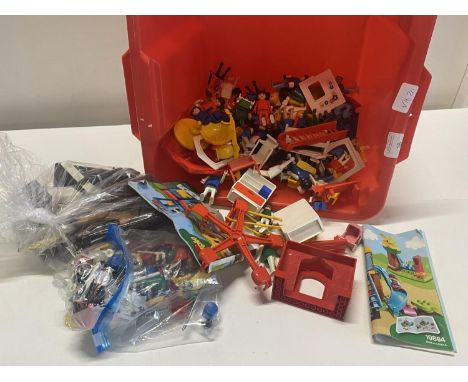 A box of assorted Play Mobil figures etc.