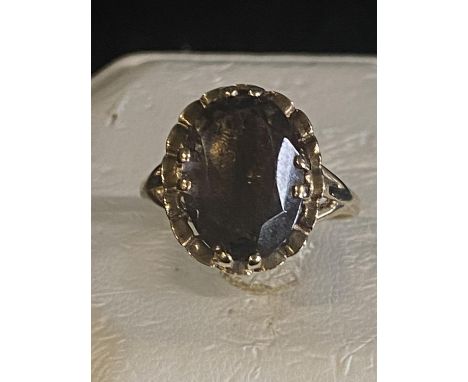 A Ladies 9ct gold smoky quartz ring in claw setting size S 4.13g