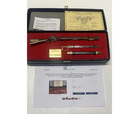 A limited edition Royal Armouries miniature Baker Rifle &amp; bayonet with scabbard. Boxed and with COA