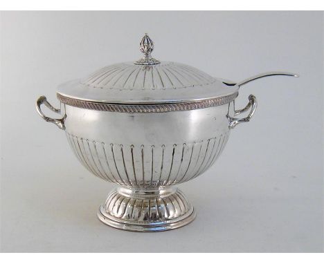 A silver-plated soup tureen or punch bowl, fluted sides and cover, gadroon rim, with associated ladle, 28 cm. high, 25.9 cm. 
