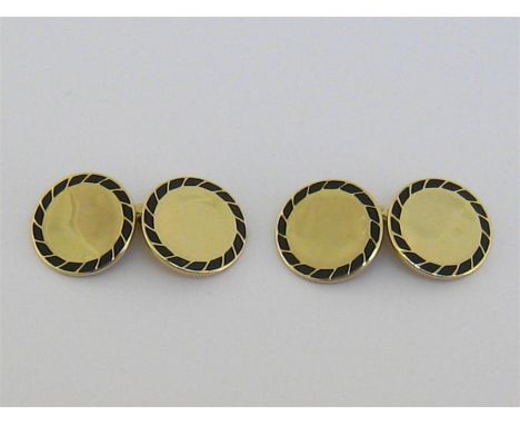 Cartier, a pair of 14 carat gold and enamel cufflinks, circa 1940, numbered '4428', the circular links with a black enamel bo