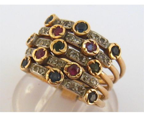 A sapphire, ruby, emerald and diamond five band ring, the yellow metal (tests 18 carat gold) shank finger size L/M, 8.2gms
