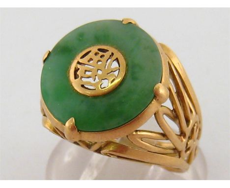 An 18 carat gold and jade ring, of openwork design, French import mark, finger size N/O, 7.5gms
