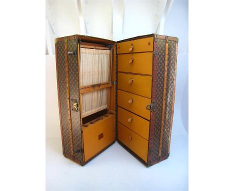 Louis Vuitton. A Louis Vuitton full size Wardrobe trunk ( malle armoire / cabine ), circa 1930s. The exterior covered with th
