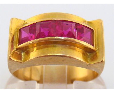 A French Art Deco 18 carat gold and synthetic ruby ring, set with a row of four calibre cut rubies, French standard marks to 