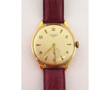 Longines, a 1960s gentleman’s 18 carat gold manual wind dress watch, the cream dial with dart and Arabic markers, tapering ha