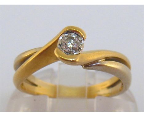 A French 18 carat gold and single stone diamond ring, the old cut brilliant approx. 0.10 carat, tension set in a two colour t