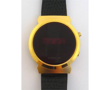 Exelar, a gentleman’s gilt metal digital watch, no. 84887, with circular case and central digital display, 34mm diameter, on 
