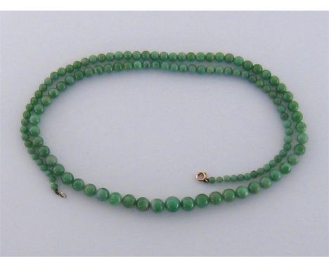 A jade bead necklace, composed of graduated spherical beads, to a bolt ring clasp, 70cm long, 48gms
