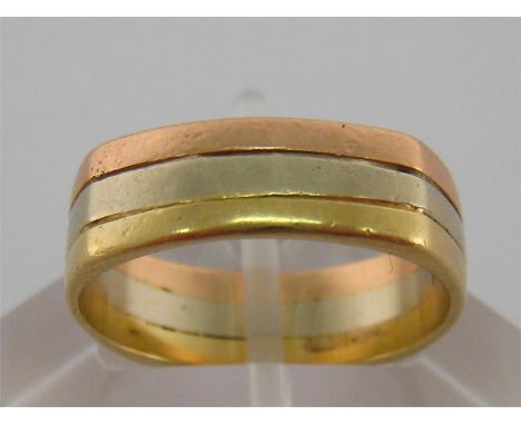 A 14 carat three colour gold ring, with squared outer band, stamped ‘14k’, finger size N/O, 5gmsCondition reportA 14 carat th