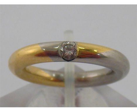 A platinum gold and diamond ring by Meister, the round brilliant cut diamond weighing 0.13 carat, Top Wesselton colour (appro