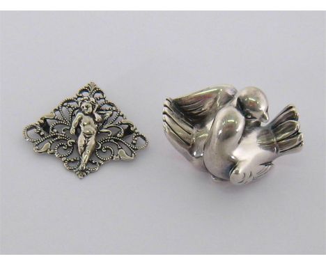 An Italian silver .970 standard ornament in the form of a pair of doves, (filled ) by the Florence Silver Factory of Bartolin