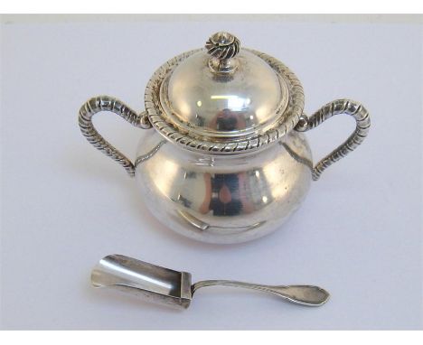 An Italian silver covered sugar bowl, .800 standard, with ropework handles and rim , 10 cm. high,and an Italian silver shovel