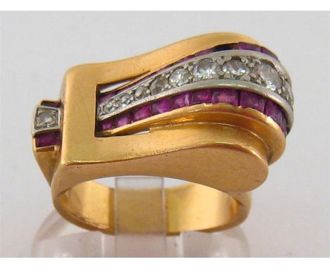 A French Art Deco 18 carat gold, platinum, diamond and ruby dress ring, designed as a stylised buckle and strap, set to the c