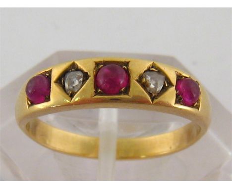 A ruby and diamond five stone ring, alternately set with cabochon rubies and rose cuts, the yellow metal (tests 18 carat gold