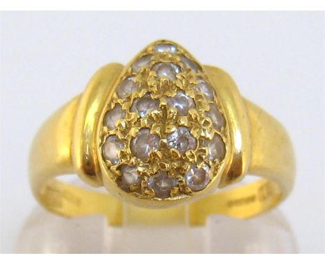 An 18 carat gold and diamond ring, the pear shaped bezel pave set overall with small brilliants, the shank fully hallmarked, 
