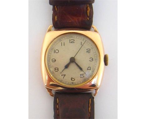 A 1940s 9 carat gold manual wind wristwatch, the cushion case with circular silver dial, outer seconds track, black Arabic nu