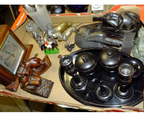 A TRAY OF TREEN AND METALWARE TO INCLUDE AN EBONISED DRESSING TABLE SET AND CARVED WOODEN SEATED FIGURE