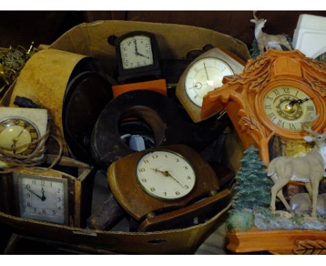 A BOX OF CLOCK PARTS FOR SPARES AND REPAIRS
