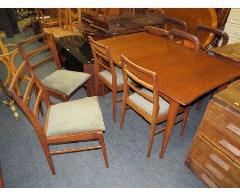 A VINTAGE GORDON RUSSELL STYLE EXTENDING TEAK DINING TABLE AND FOUR CHAIRS - TABLE H-73 CM L-132 CM ( EXTENDED L-192 CM )