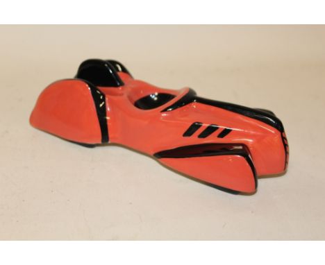 A LORNA BAILEY CERAMIC FIGURE OF A VINTAGE RACE CAR