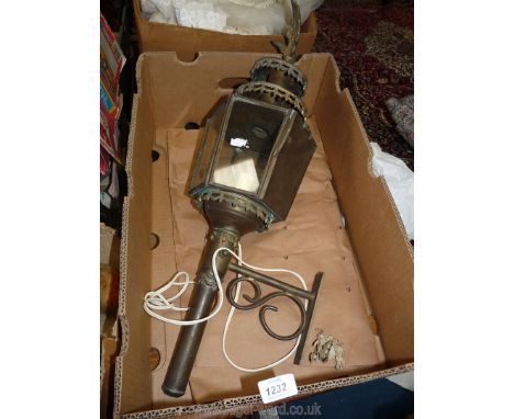 A Coach Lamp converted to electric with wall bracket and eagle finial.