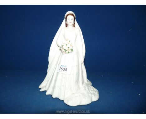 A Royal Worcester 2007 'Her Majesty Queen Elizabeth II, Diamond Wedding Anniversary' figure. 9 1/4" tall.