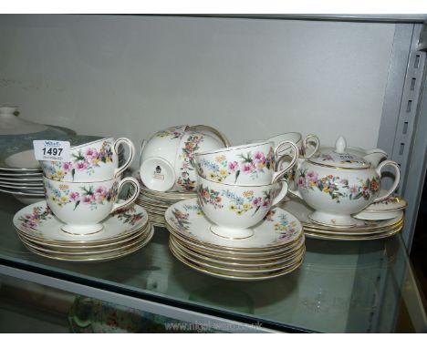 A Wedgwood 'Downland' part Teaset including nine cups, 12 saucers, cake and tea plates, milk jug, slop bowl, sucrier etc.