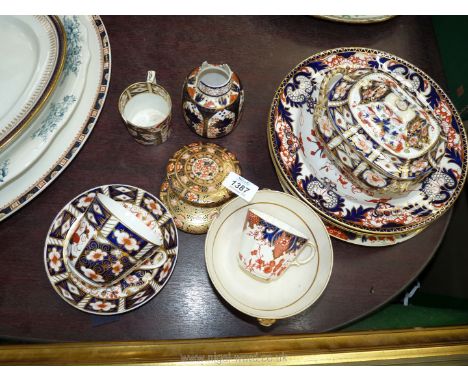 A quantity of Royal Crown Derby in Imari pattern to include; cups, saucers, plates, tureen, footed dish, vase, etc. All have 