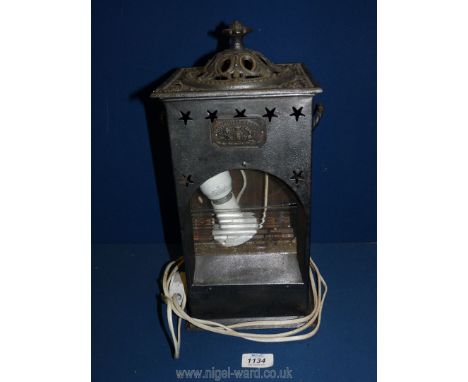 **A Rippingilles patent cast iron stove Lamp, glass a/f. 15" tall x 8" wide. **(cable has been removed as it did not meet ele