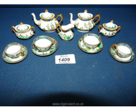 A very pretty Crown Staffordshire oriental design miniature Teaset with scenes of pagodas, monuments etc, two each teapots an