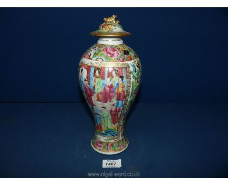 A 19th c. oriental Famille Rose baluster shaped lidded Vase/Jar decorated with  flowers and butterflies, reserves with scenes