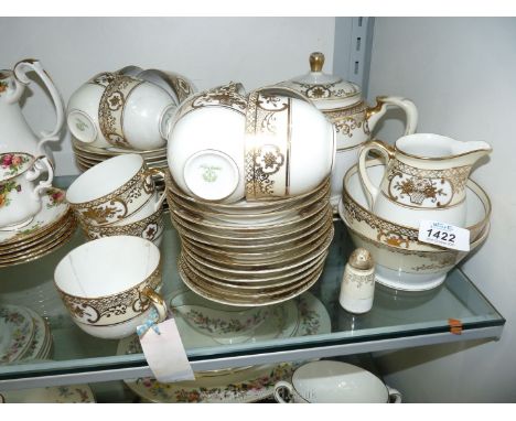A Noritake Teaset in cream and gilding including teapot, eleven cups, twelve saucers and tea plates, two bread and butter pla