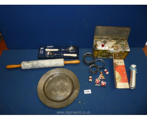 An old biscuit tin containing cake decorating tubes, a pewter plate 9 1/4", a boxed pair of salad servers and a heavy marble 