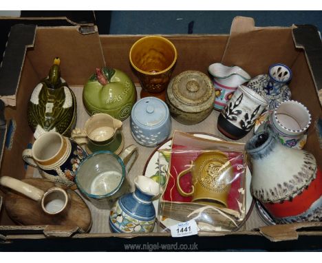 A quantity of pottery including German flagon, Poole vase, Moulin Huet Guernsey pottery vase, Duck on a nest, Sylvac Apple sa