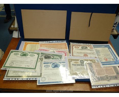 Two folders of Russian and American share certificates from mining, chemical industries etc, 1930-1975.