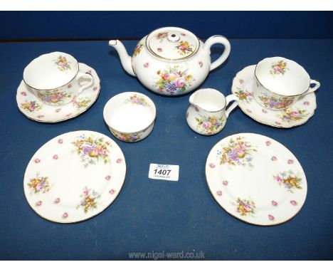 A Royal Doulton tea for two to include teapot, cream jug, sugar bowl, two cups, two saucers and two tea plates.