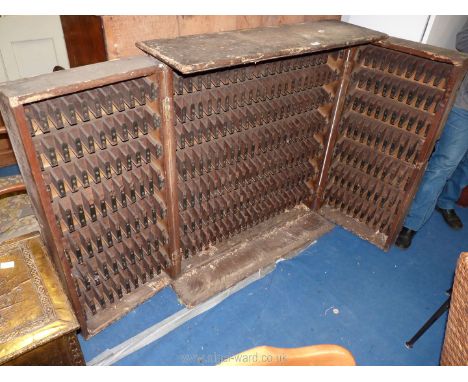 A Pine railway ticket Cupboard, 43'' high x 40 3/8'' wide x 12 1/2'' deep, with double doors opening to reveal seven rows of 