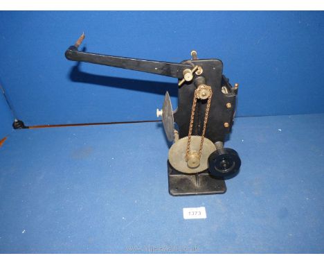 A collectable hand crank driven Movie Projector appearing to be for 35mm film and with interesting gear and chain driven mech