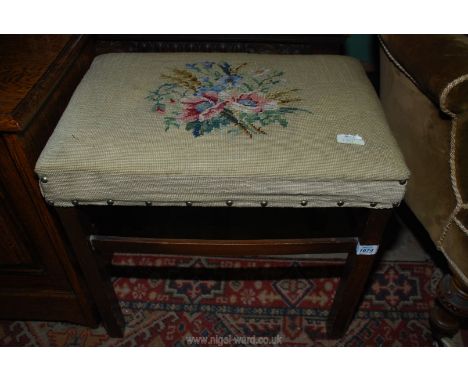 A darkwood framed Dressing Stool having a tapestry upholstered seat depicting a stylised spray of flowers, 20'' x 13 1/2'' x 