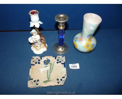  A hand painted floral vase,ornate porcelain candlestick, plated rimmed and glass bodied candlestick and an old ceramic tile,