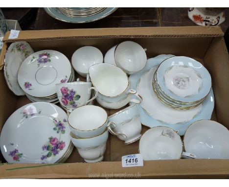 A Duchess part tea set decorated in pink carnations and baby blue border to include; 5 cups &amp; saucers, milk jug, sugar bo