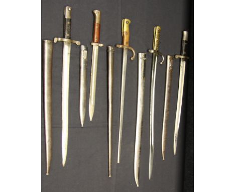 FIVE BAYONETS, 19TH CENTURY including a Chassepot bayonet, dated 1874, in its scabbard; a Gras bayonet, dated 1877; two Portu