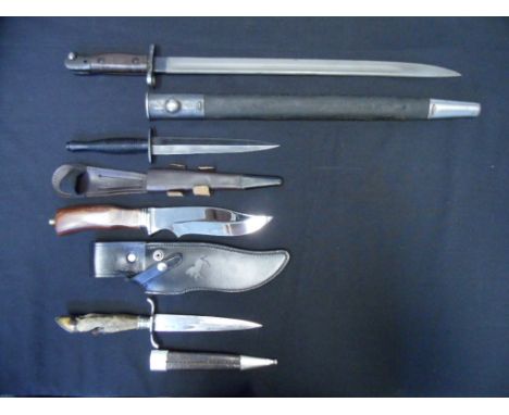 A GERMAN HUNTING DAGGER, A 1907 BAYONET, AND TWO FURTHER KNIVES, 20TH CENTURY the first with double-edged blade, and grip for