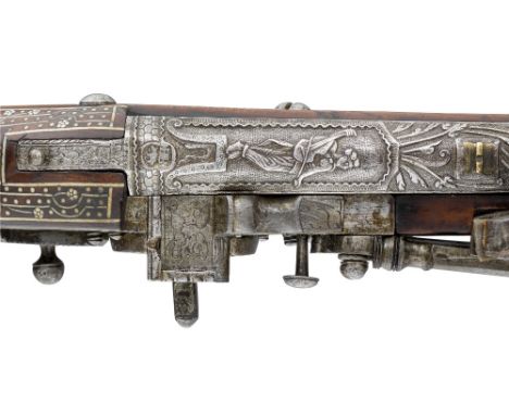 A FINE 60 BORE GERMAN (THURINGIAN) WHEEL-LOCK CARBINE, SUHL, LATE 16TH CENTURY with tapering barrel chiselled against a finel