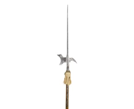 A GERMAN HALBERD, LAST QUARTER OF THE 16TH CENTURY with long terminal spike of diamond-section, forward-leaning axe-blade pie
