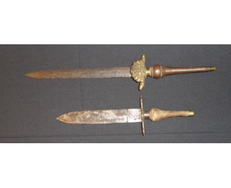 TWO CONTINENTAL PLUG BAYONETS, MID-17TH CENTURY the first with double-edged blade (pitted), brass hilt with acorn quillon ter