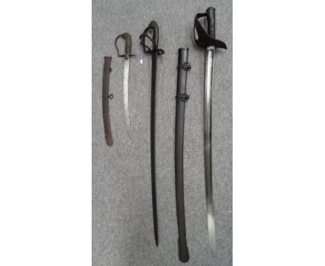 A CAVALRY SWORD FOR A BOY AND TWO CONTINENTAL REGULATION SWORDS, 19TH CENTURY the first with curved blade double-edged toward