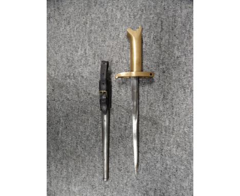 A MODERN COPY OF A PRITCHARD GREENER REVOLVER BAYONET  brass hilt stamped Patent/17143/16, in its steel scabbard with leather