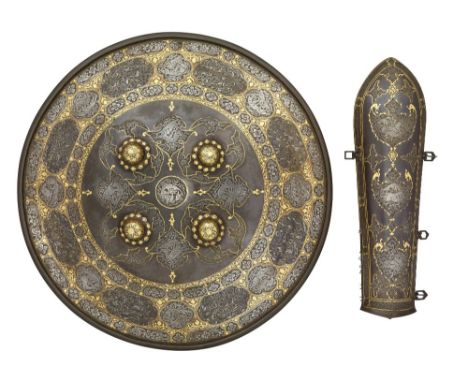 A DECORATED INDO-PERSIAN DHAL AND BAZU-BAND,19TH CENTURY the dhal fitted with four central bosses, decorated with silver koft